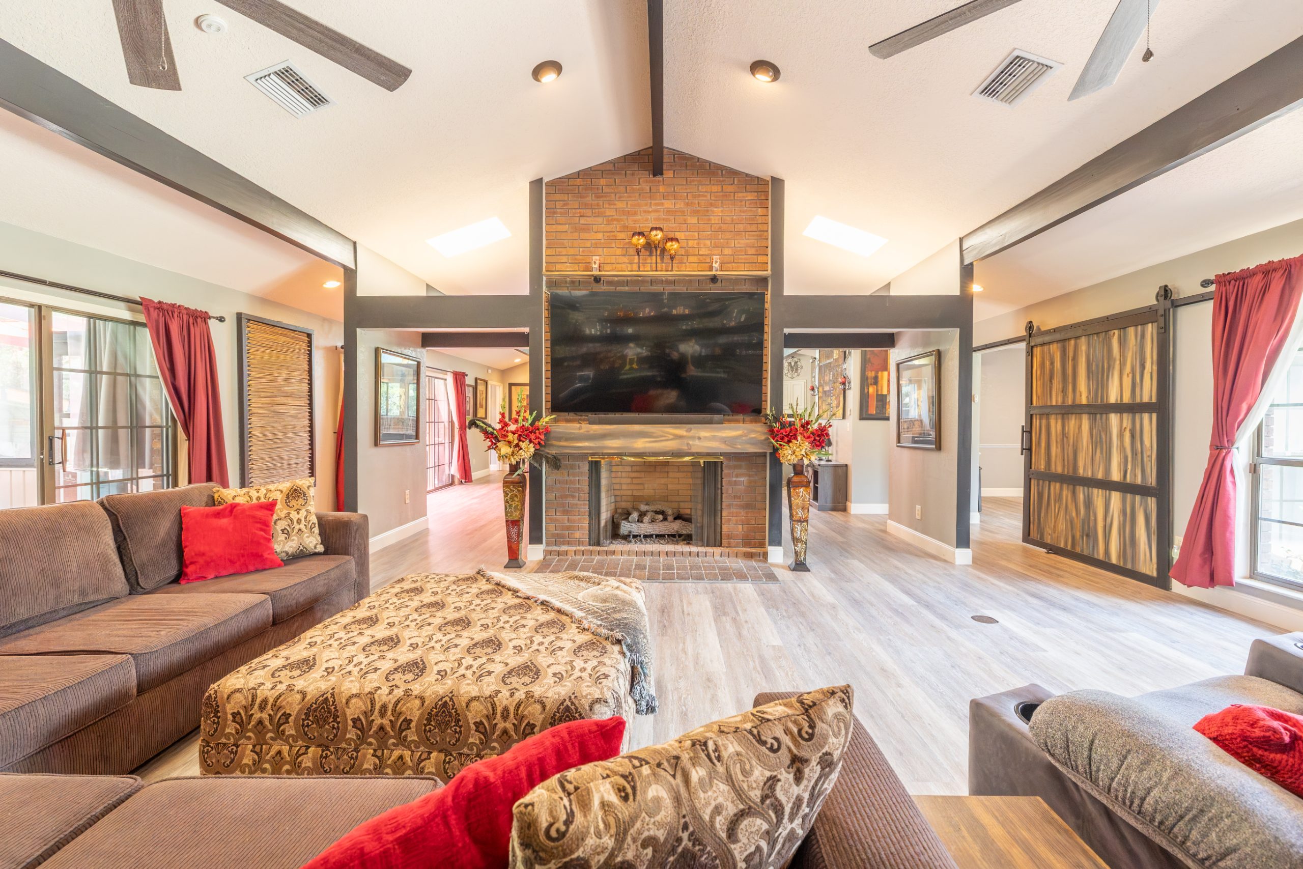 Great room with stone fireplace and vaulted ceiling