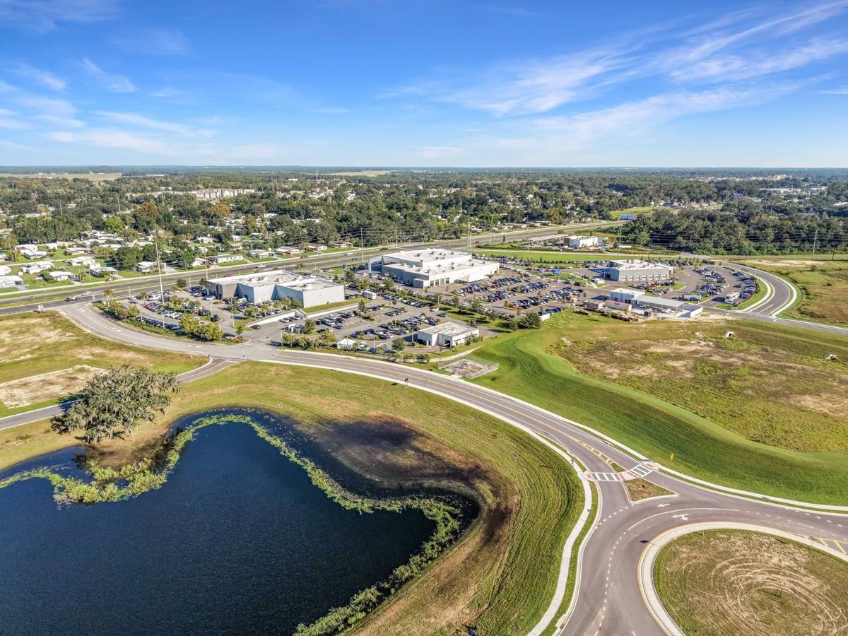 Aerial photo of a new car dealership and retention pond in Ocala, FL