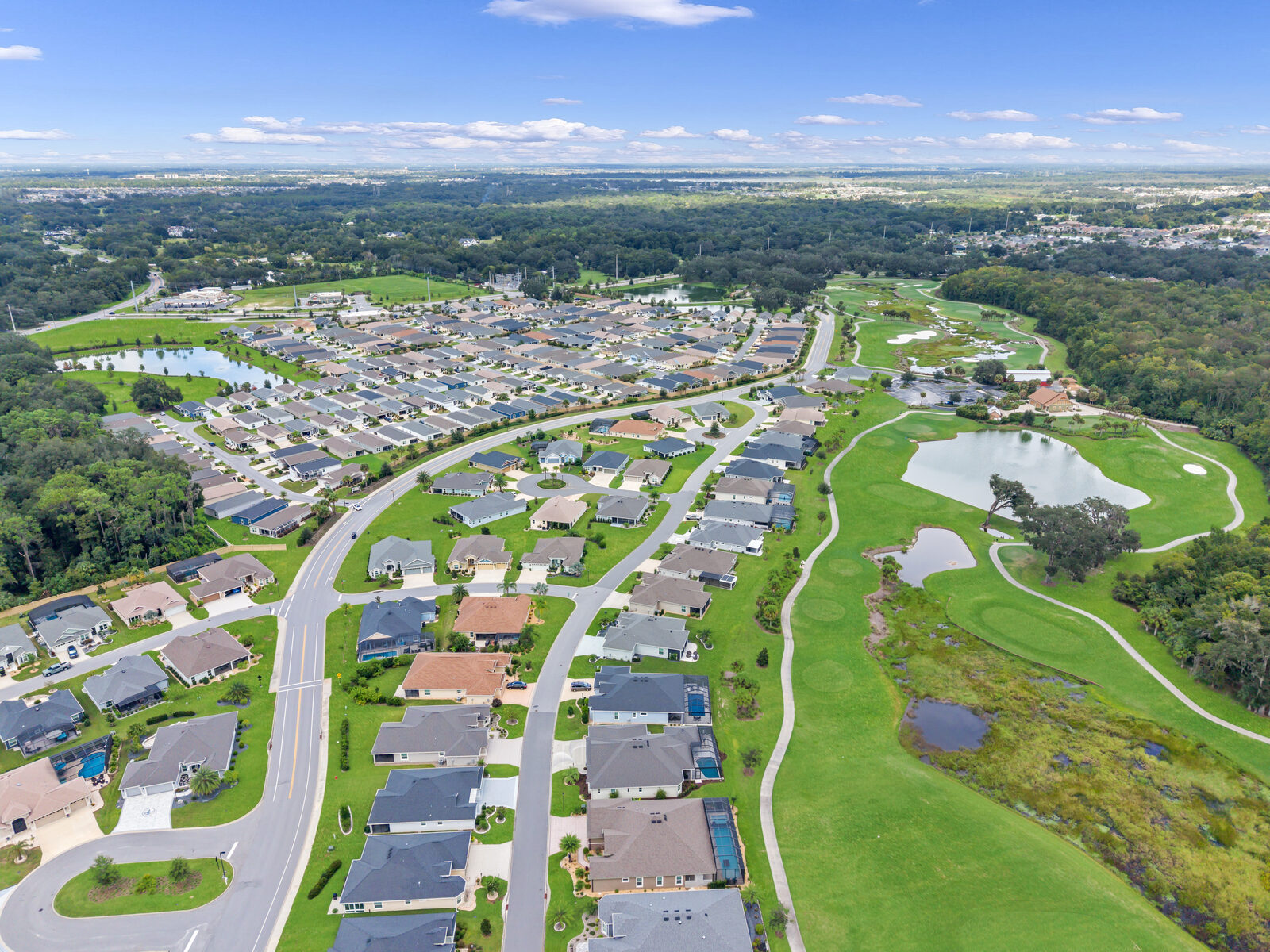 Aerial drone view over an Ocala golf community listing