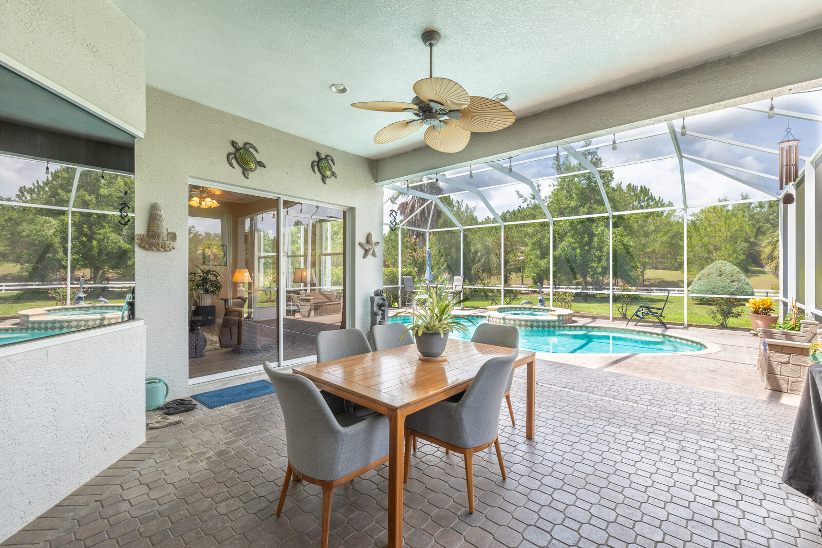 Screened lanai with pool and outdoor dining