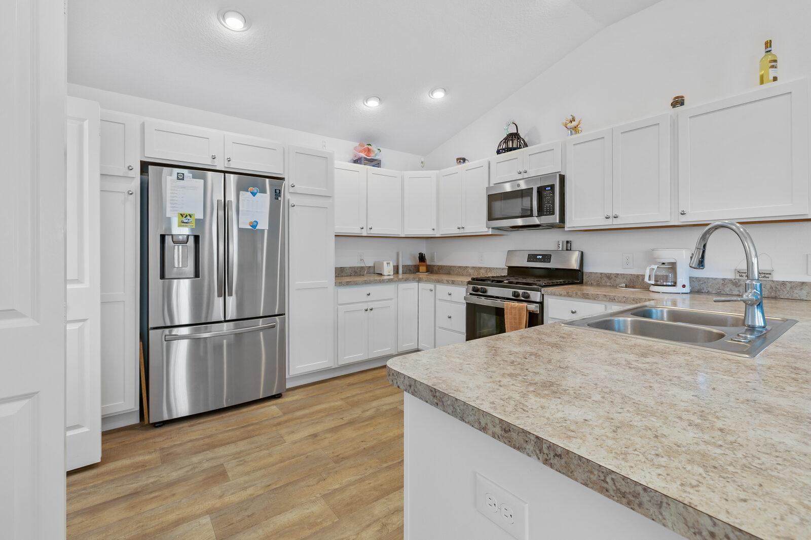 Bright modern kitchen with stainless appliances